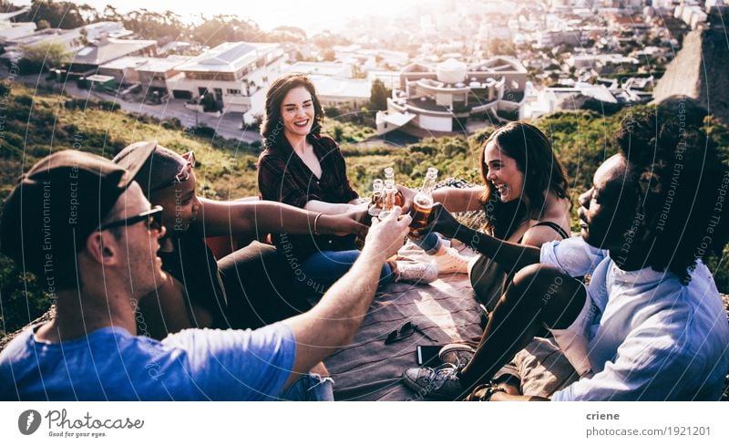 Mutli Ethnical group toasting and drinking beer on a rock Beverage Drinking Alcoholic drinks Beer Lifestyle Joy Summer Mountain Feasts & Celebrations Birthday