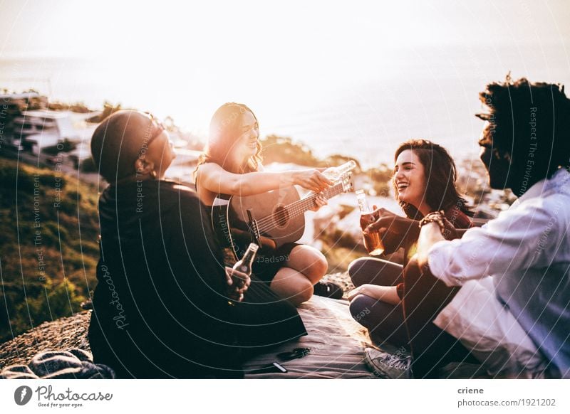 Group of friends enjoying drinks and playing guitar Beverage Alcoholic drinks Beer Bottle Lifestyle Music To talk Friendship Adults Guitar To enjoy Listening