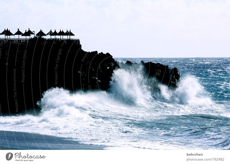 the umbrellas and the sea Vacation & Travel Far-off places Freedom Nature Landscape Sky Horizon Climate change Wind Gale Rock Waves Coast Beach Ocean Island