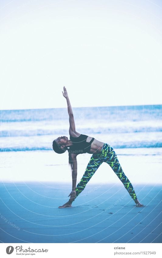 Strong fit female doing yoga exercise on the beach early morning Lifestyle Personal hygiene Body Wellness Relaxation Leisure and hobbies Beach Ocean Waves