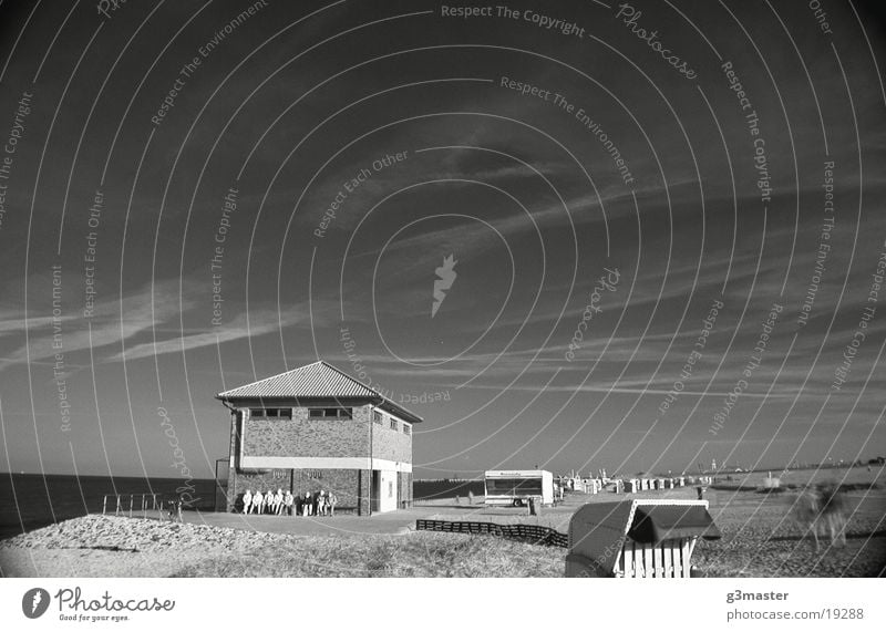 DLRG House Beach Spiekeroog Beach chair Infrared Human being Europe Sun dlg Black & white photo Sky Beautiful weather Bench