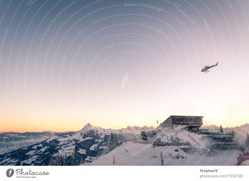 Hahnenkamm mountain station Tourism Freedom Winter Snow Winter vacation Mountain Skiing Logistics Aviation Landscape Sky Cloudless sky Horizon Sunrise Sunset