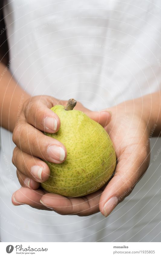 close up of hands - woman holding a yellow pear Fruit Vegetarian diet Diet Summer Garden Thanksgiving Gardening Human being Woman Adults Hand Fingers Nature