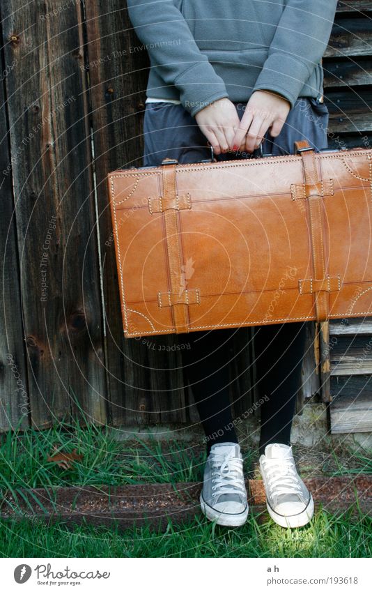 on the way Vacation & Travel Trip Feminine Hand Feet 1 Human being Grass Facade Footwear Suitcase To hold on Wait Brown Green Calm Curiosity Longing