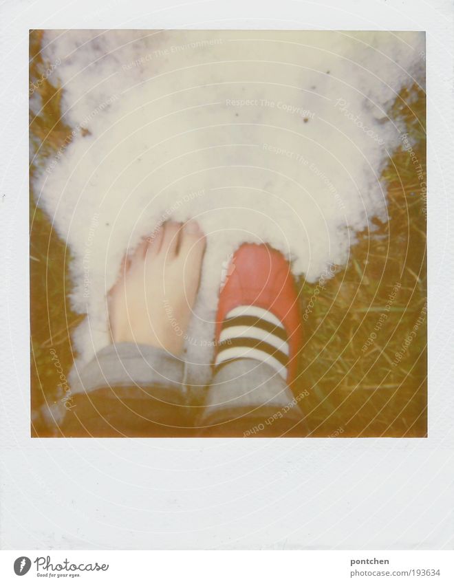 A bare foot of a woman standing in the snow. Test of courage. Red ballerina feet 1 Human being Earth Winter Grass Meadow Clothing Pants Jeans Footwear Ballerina