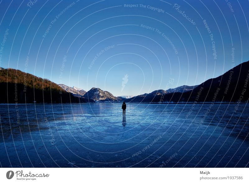 Walking on Ice Frozen surface Human being 1 Environment Nature Landscape Water Sky Horizon Winter Beautiful weather Frost Forest Hill Mountain Lake Fuschlsee