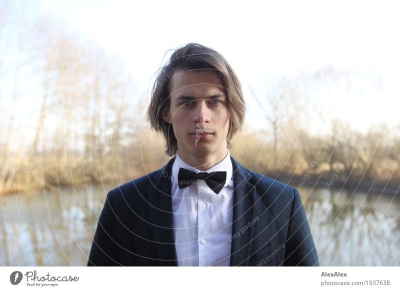 ready to go out - young man in suit with bow tie in front of a lake in autumn Style Young man Youth (Young adults) Face 18 - 30 years Adults Landscape Plant Sky