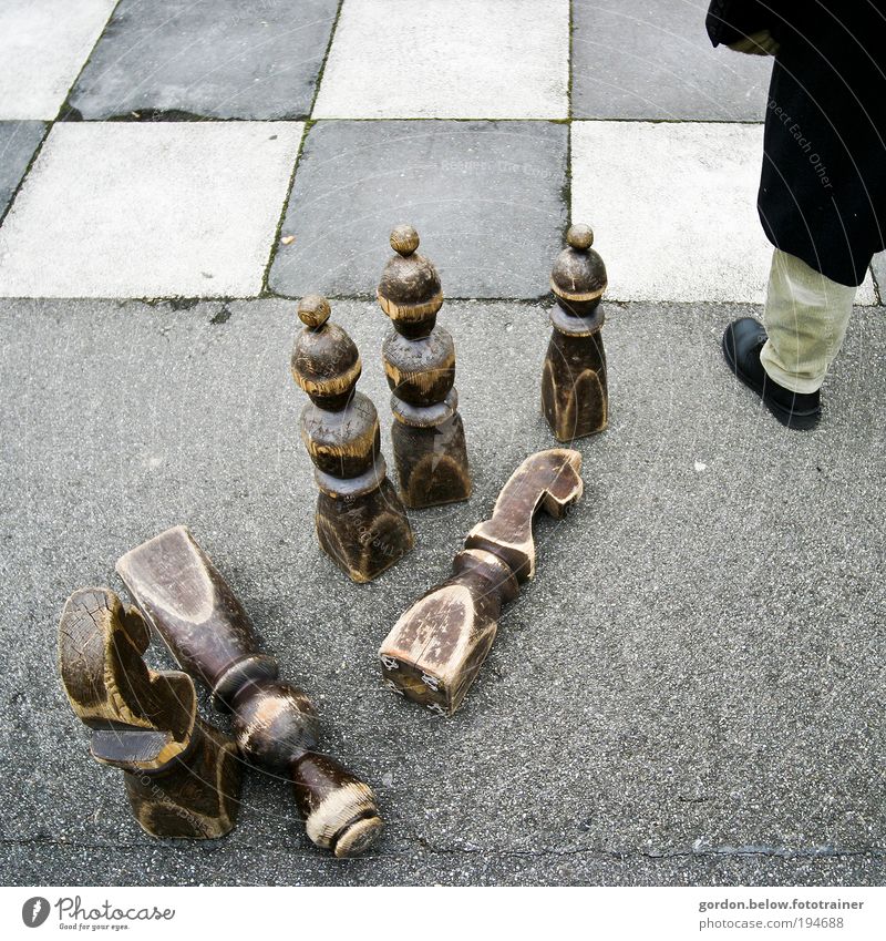 equestrian sport Board game Chess Male senior Man 1 Human being Playing Looking Stand Wait Curiosity Colour photo Subdued colour Exterior shot Copy Space right