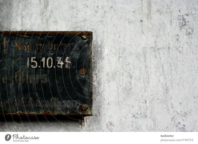 late Machinery Metal Rust Sign Characters Digits and numbers Signs and labeling Signage Warning sign Old Gray Stagnating Decline Past Transience Date