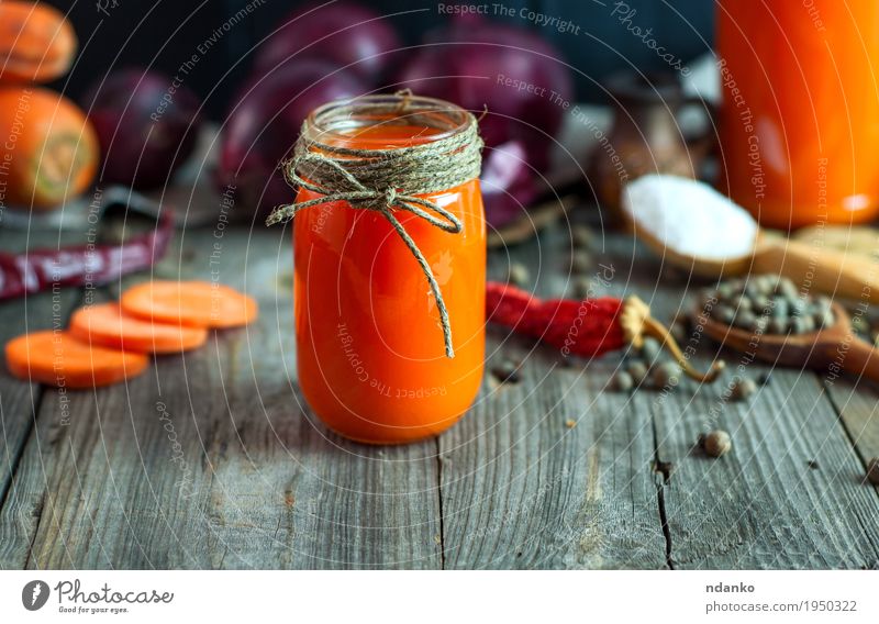 Fresh carrot juice in a glass jar Vegetable Herbs and spices Nutrition Vegetarian diet Beverage Juice Bottle Table Rope Diet Old Eating Delicious Natural Gray