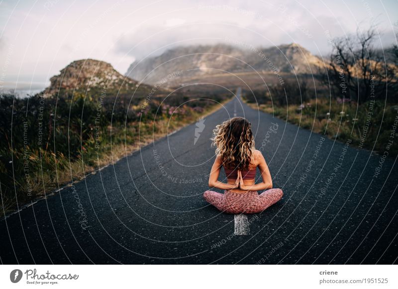 Young caucasian women doing namaste yoga pose on road Lifestyle Happy Personal hygiene Harmonious Well-being Vacation & Travel Trip Adventure Freedom Mountain