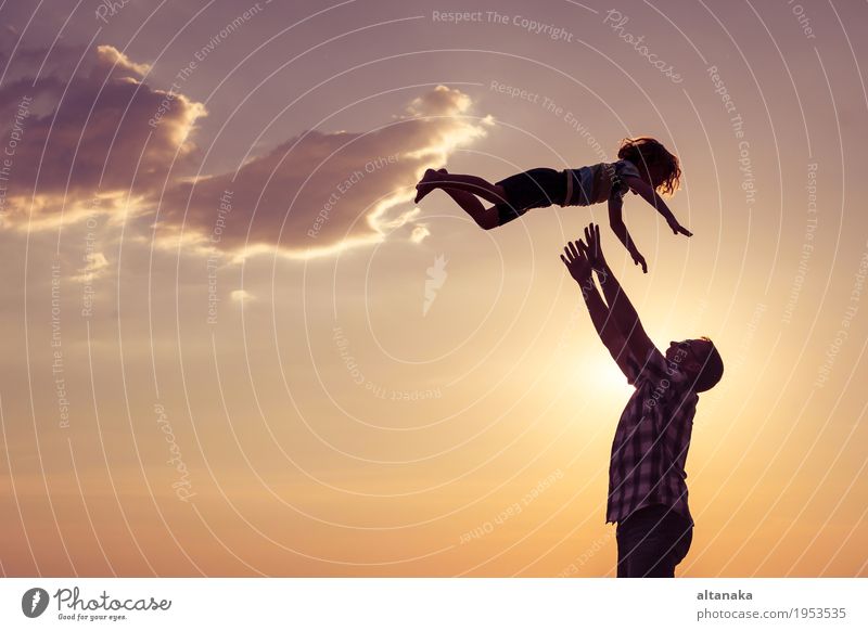 Father and son playing on the beach at the day time. Concept of friendly family. Lifestyle Joy Leisure and hobbies Playing Vacation & Travel Trip Freedom Summer