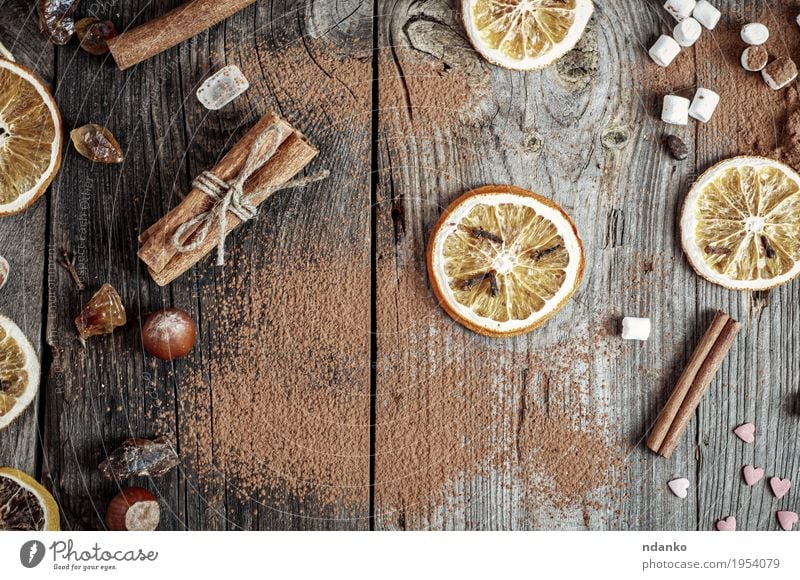 Abstract gray wooden background with spices and dried fruit Food Herbs and spices Table Kitchen Wood Old Retro Brown Gray Orange Tradition Preparation sweet