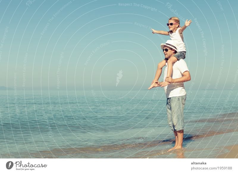 Father and daughter playing on the beach at the day time. Lifestyle Joy Relaxation Leisure and hobbies Playing Vacation & Travel Trip Freedom Summer Sun Beach