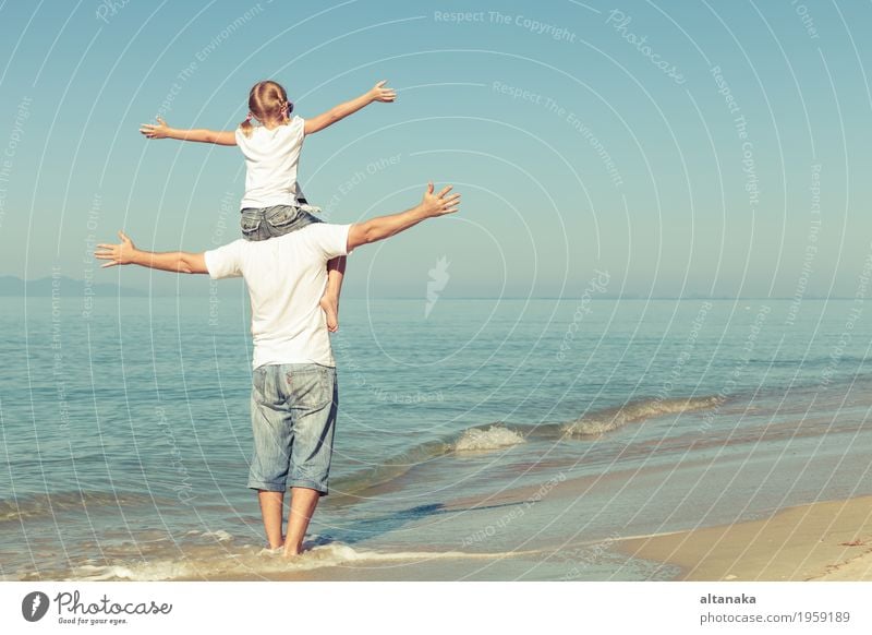 Father and daughter playing on the beach at the day time. Lifestyle Joy Relaxation Leisure and hobbies Playing Vacation & Travel Trip Freedom Summer Sun Beach