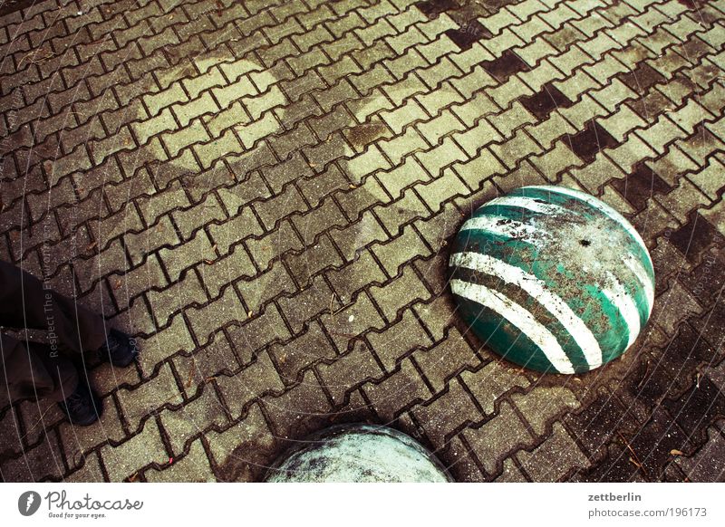 Photo with stones, but without title Stone Paving stone Cobblestones Sidewalk Lanes & trails Seam Profile profile stones Bollard Stripe Shadow Wet Dry Feet Legs