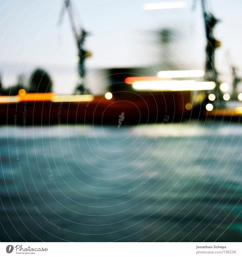 Floating ship and harbour cranes passing the harbour with blurred and motion blur Port City Transport Navigation Container ship Harbour Blue Hamburg