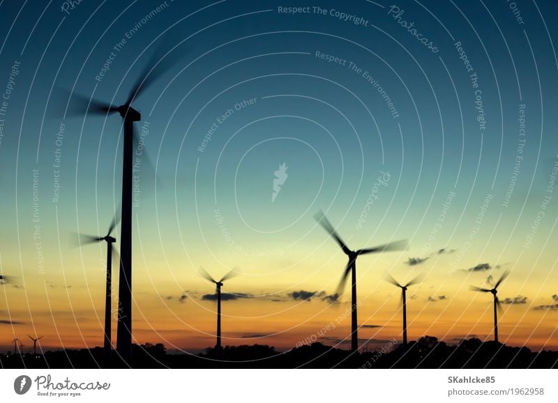 Wind turbines at sunset Machinery Technology Science & Research Advancement Future High-tech Energy industry Renewable energy Wind energy plant Industry