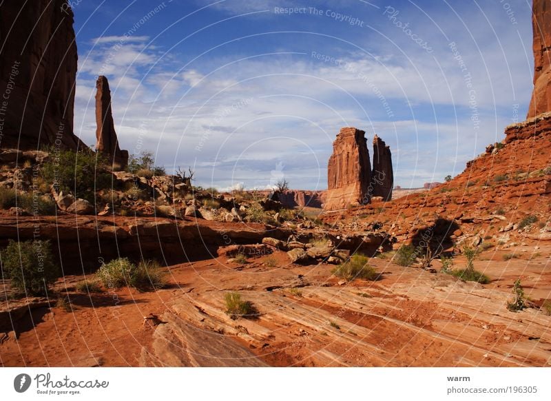 vast land high pillars Environment Nature Landscape Sky Clouds Sunlight Beautiful weather Arches National Park Wanderlust Colour photo Exterior shot Deserted