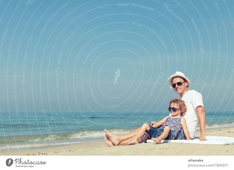 Father and son playing on the beach at the day time. Lifestyle Joy Relaxation Leisure and hobbies Playing Vacation & Travel Trip Freedom Summer Sun Beach Ocean