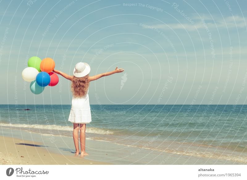 Teen girl with balloons standing on the beach Lifestyle Joy Happy Relaxation Leisure and hobbies Playing Vacation & Travel Trip Adventure Freedom Summer Sun