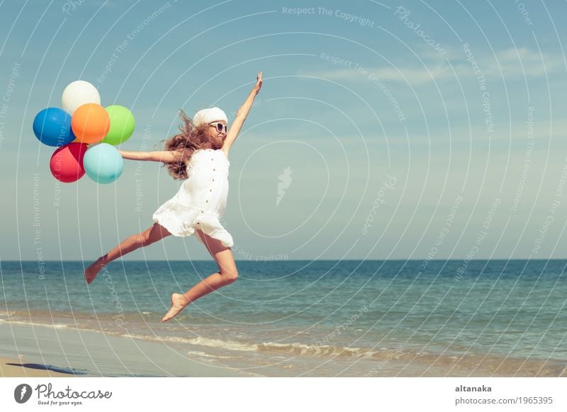 Teen girl with balloons jumping on the beach Lifestyle Joy Happy Relaxation Leisure and hobbies Playing Vacation & Travel Trip Adventure Freedom Summer Sun