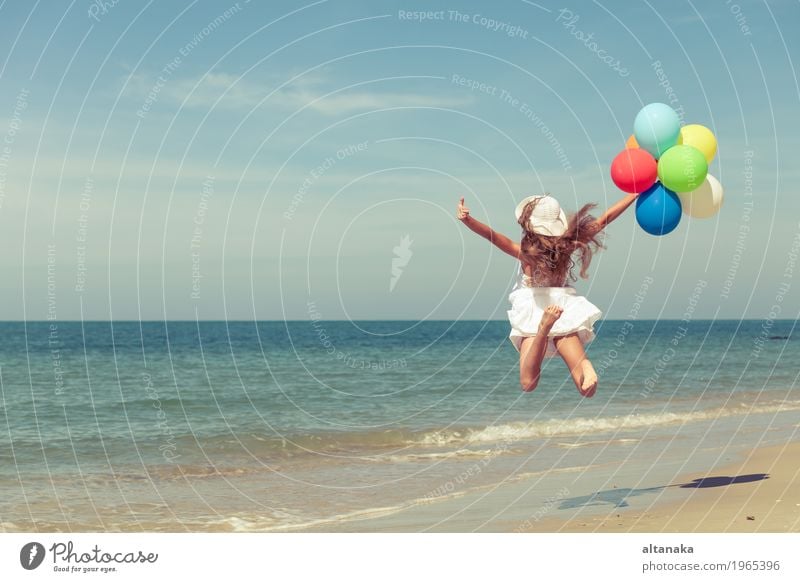 Teen girl with balloons jumping on the beach Lifestyle Joy Happy Relaxation Leisure and hobbies Playing Vacation & Travel Trip Adventure Freedom Summer Sun