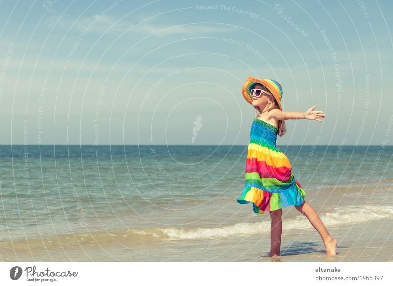 Little girl standing on the beach Lifestyle Joy Happy Relaxation Leisure and hobbies Playing Vacation & Travel Trip Adventure Freedom Summer Sun Beach Ocean