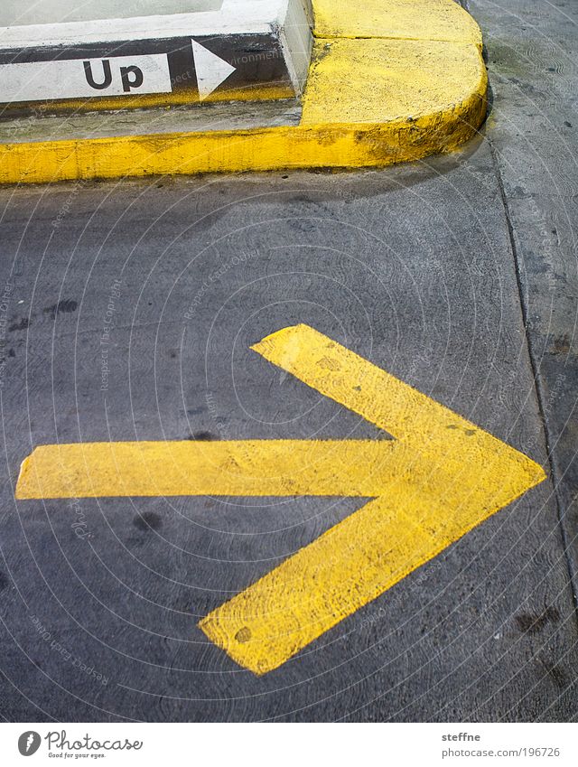 upright upright USA Testing & Control Arrow Parking garage Above Yellow Asphalt Signage Colour photo