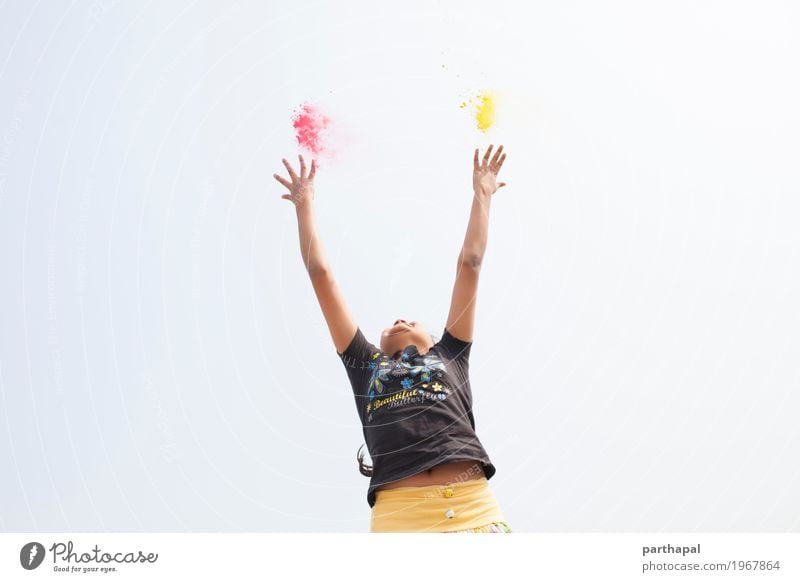 A girl stretching arms and throwing Color powder Lifestyle Girl Arm Hand 1 Human being 8 - 13 years Child Infancy Fitness Jump Happiness Enthusiasm Power Energy