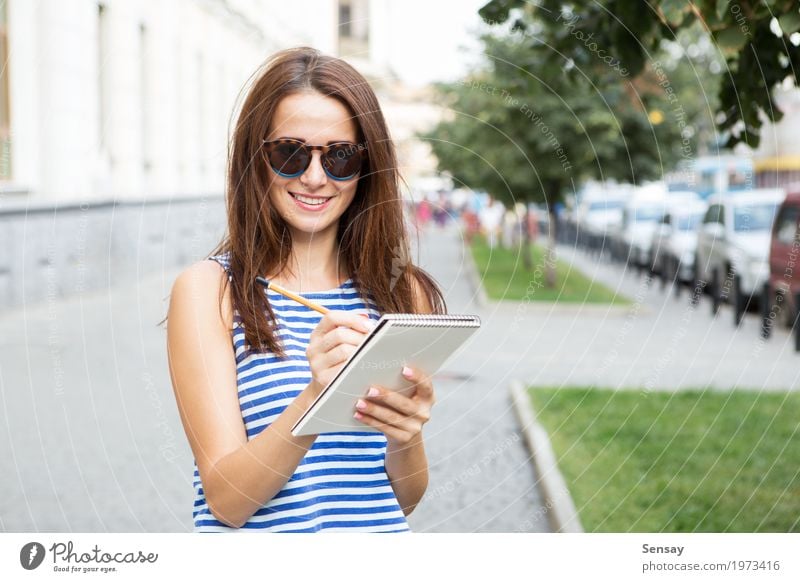 Girl with a notebook on the street Happy Beautiful Trip Summer Human being Woman Adults Youth (Young adults) Musical notes Book Park Street Fashion Sunglasses