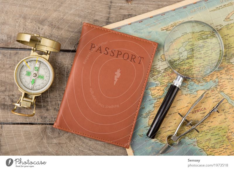 compass and vintage map on the wooden desk Vacation & Travel Trip Adventure Decoration Desk Earth Wall (barrier) Wall (building) Leather Old Historic Retro gold