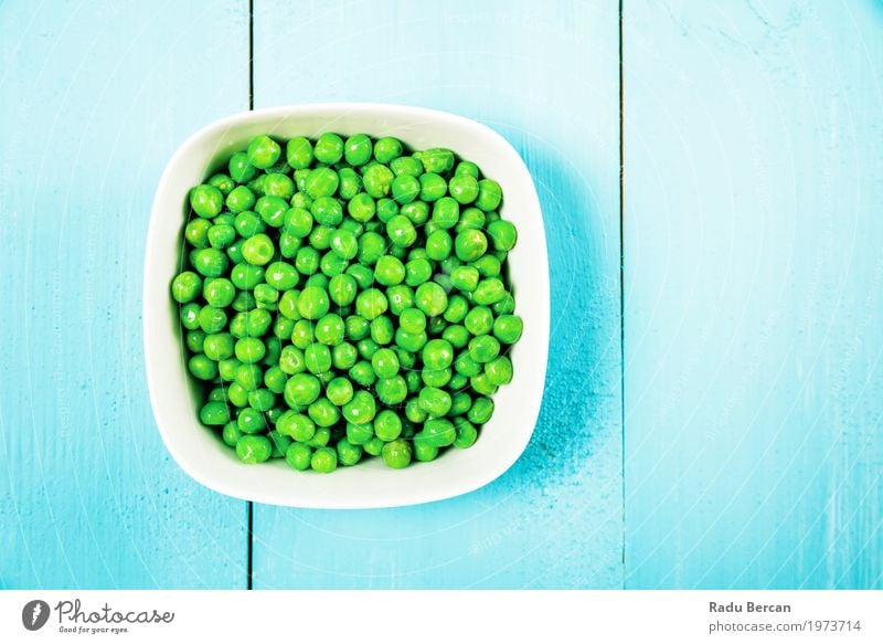 Fresh Green Peas In White Bowl On Turquoise Table Food Vegetable Nutrition Eating Organic produce Vegetarian diet Diet Environment Plant Wood To feed Feeding