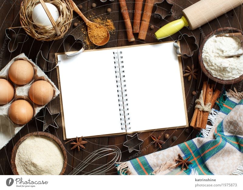 Blank cooking book, ingredients and utensils top view Food Dairy Products Grain Dough Baked goods Bread Dessert Herbs and spices Bowl Table Kitchen Paper Wood