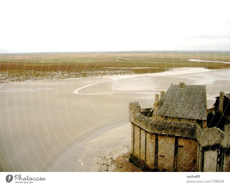 Ebb tide at Mont Saint Michel, Normandy Culture Landscape Elements Water Horizon Fog Ocean Church Castle Monastery Tourist Attraction Brown Yellow Normandie