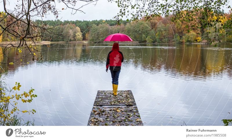 bottom water, top water Human being Feminine Woman Adults 1 45 - 60 years Environment Nature Landscape Autumn Bad weather Lake Protective clothing Jeans