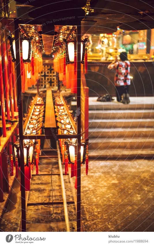 A person praying in temple Decoration Lamp Human being Culture Building Red Religion and faith Lantern light Temple Hongkong Asia Buddhism Church service asian