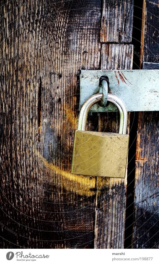 Closed Wood Old Lock Mysterious Confine Texture of wood Locking bar Padlock Metal Captured Key service Colour photo Exterior shot Contrast