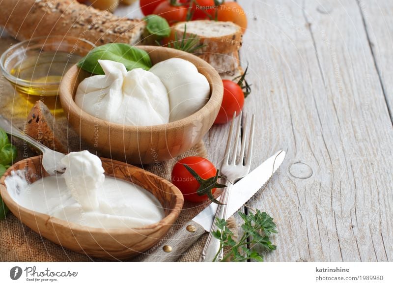 Italian cheese burrata with bread, vegetables and herbs Cheese Vegetable Bread Herbs and spices Cooking oil Nutrition Vegetarian diet Italian Food Bowl Fork