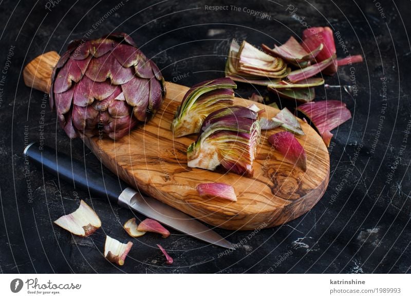 Roman Artichokes on a wooden board with knife Vegetable Nutrition Vegetarian diet Knives Fresh Gray Green agriculture Purple cooking Cut Edible food Half