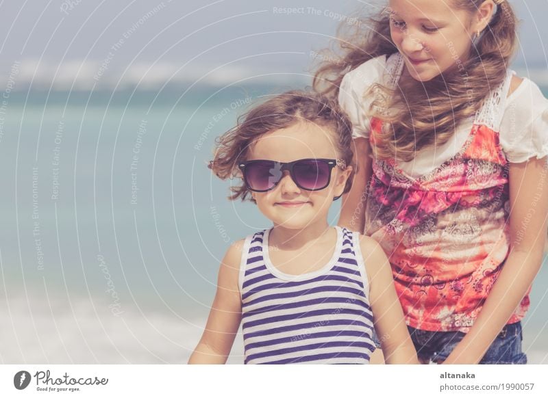 Sister and brother playing on the beach at the day time. Lifestyle Joy Happy Beautiful Relaxation Leisure and hobbies Playing Vacation & Travel Freedom Summer