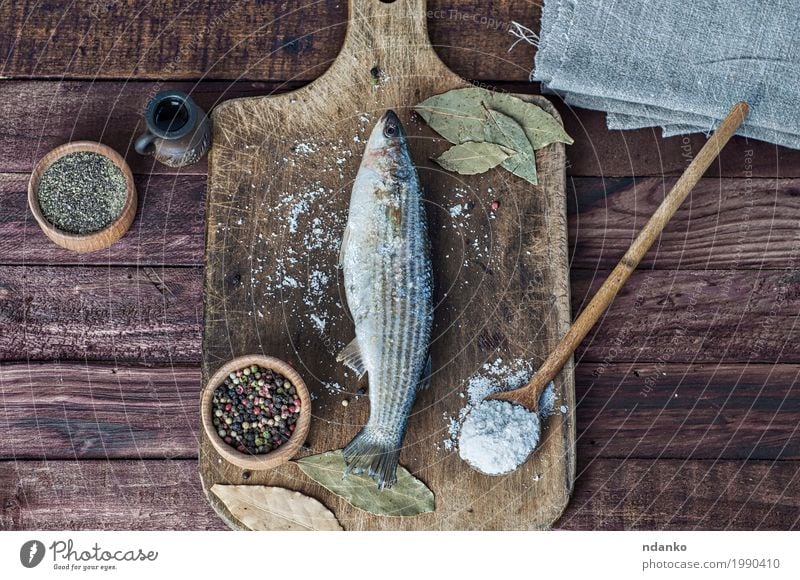 Fresh smelt fish on the kitchen board Food Fish Herbs and spices Eating Spoon Table Kitchen Nature Wood Natural Above Brown White pepper paprika whole salt