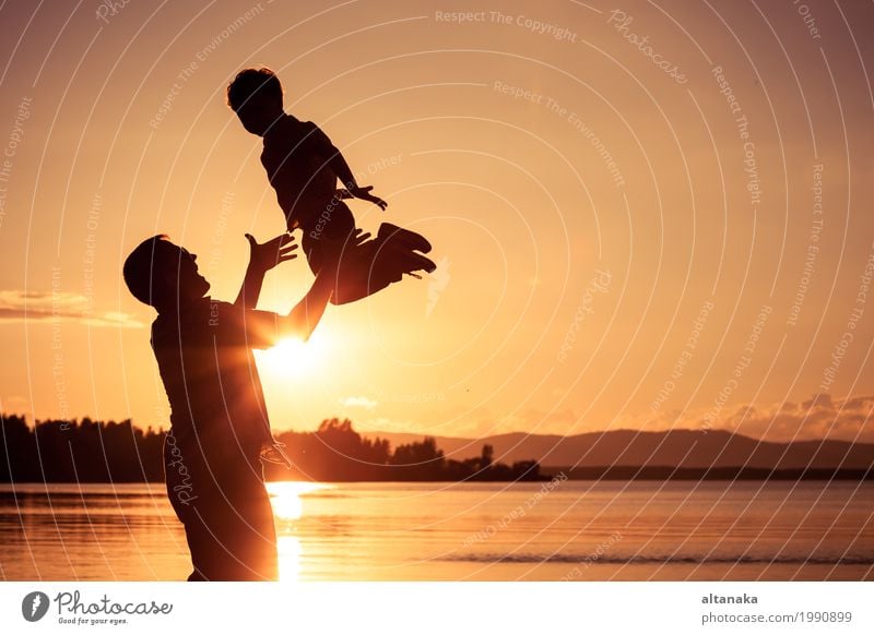 Father and son playing at the sunset time. Lifestyle Joy Happy Leisure and hobbies Vacation & Travel Adventure Freedom Camping Summer Sun Beach Mountain Hiking