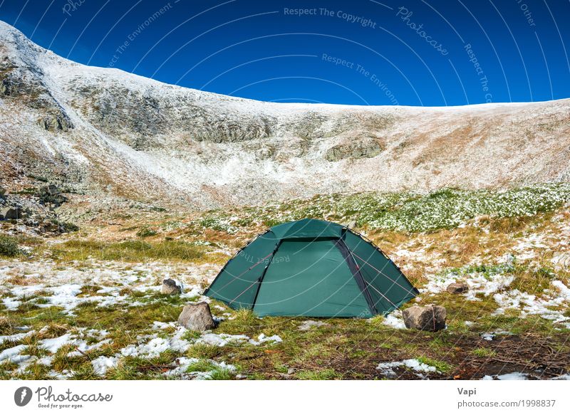 Green tent on the green lawn in snow mountains Lifestyle Leisure and hobbies Vacation & Travel Tourism Trip Adventure Camping Winter Snow Winter vacation