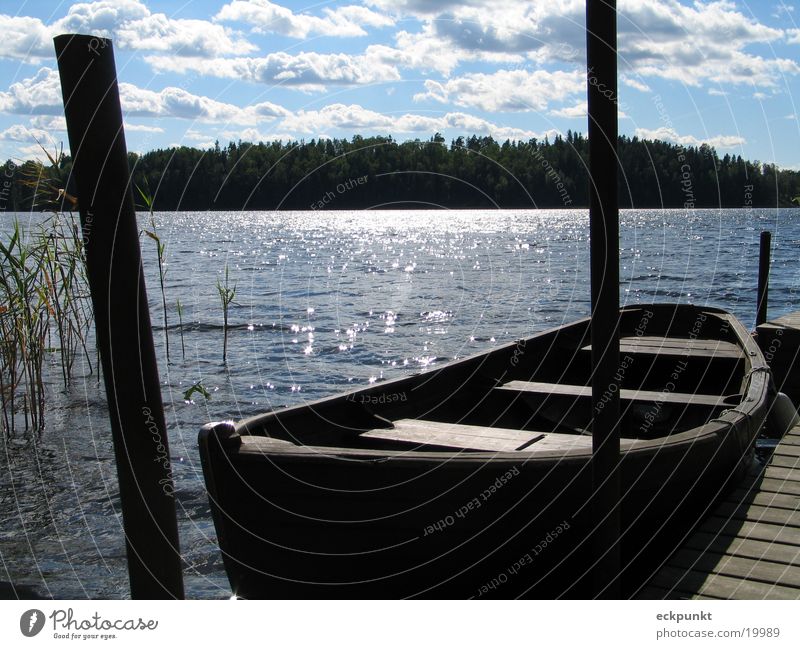 Lake in Sweden Watercraft Footbridge Clouds Sun