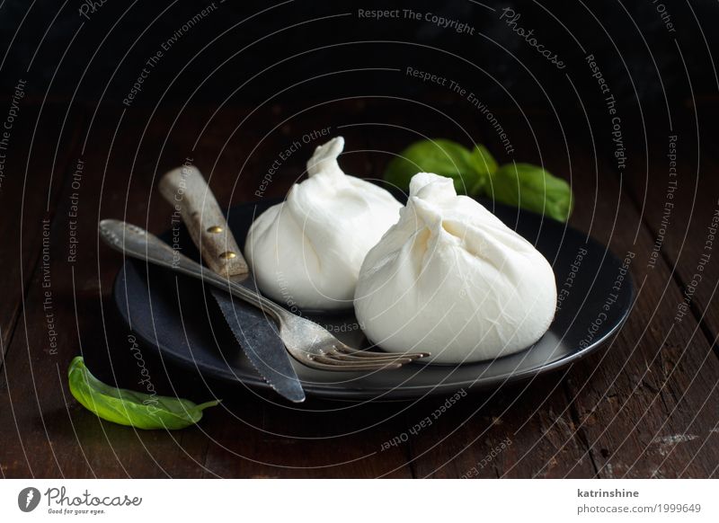 Italian cheese burrata with fork and knife Cheese Dairy Products Nutrition Italian Food Wood Dark Fresh Delicious Soft White appetizer Apulia background cream