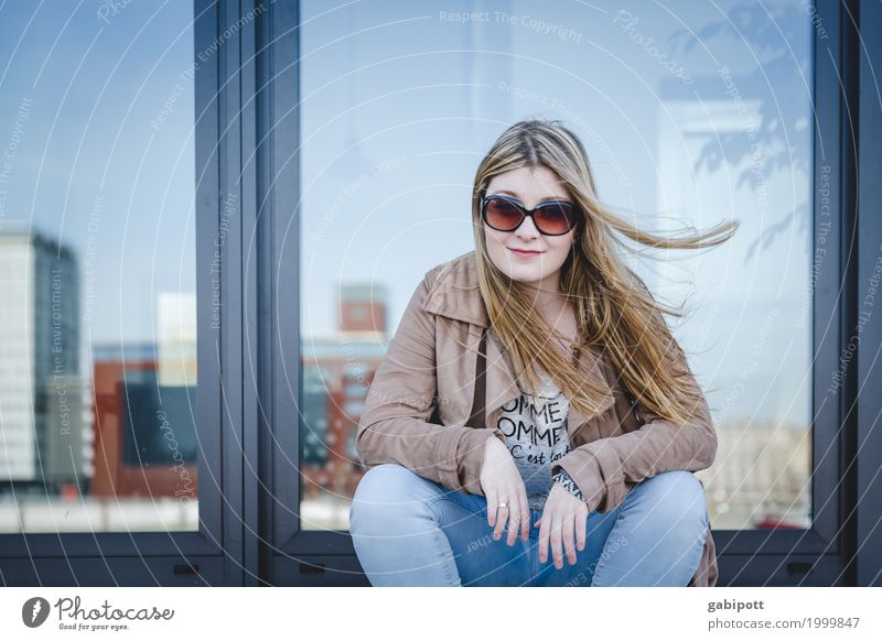 young woman sitting on a staircase Lifestyle Human being Feminine Young woman Youth (Young adults) Woman Adults 1 18 - 30 years Sit pretty Modern Town Blue