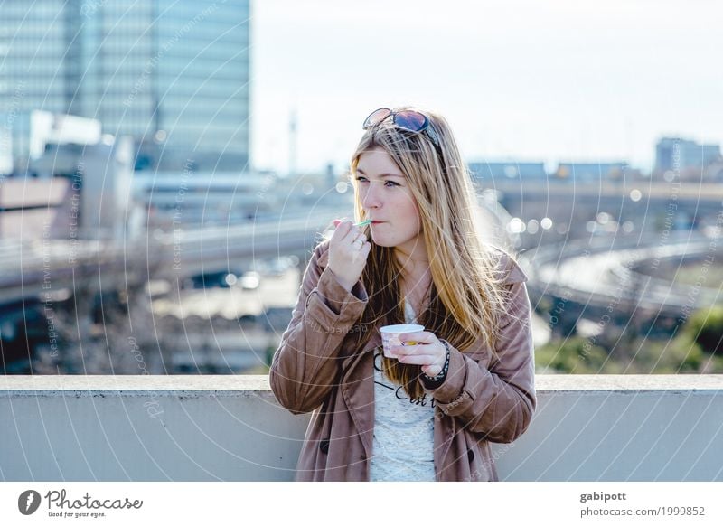 young woman against urban background eating ice cream Lifestyle Contentment Feminine Young woman Youth (Young adults) Woman Adults 1 Human being 18 - 30 years