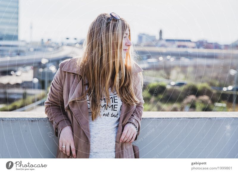 young woman against urban background Lifestyle Human being Feminine Young woman Youth (Young adults) Woman Adults 1 18 - 30 years pretty Town Warmth Happiness