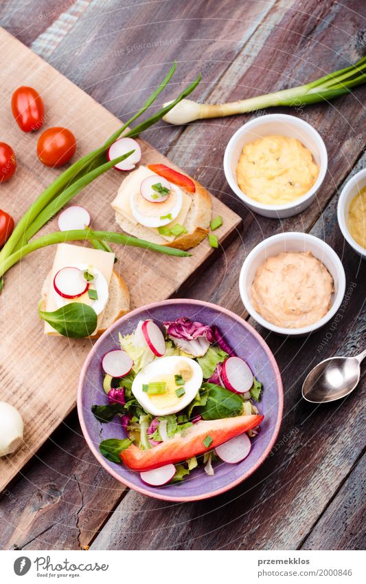 Healthy meal with eggs and vegetables Food Vegetable Lettuce Salad Bread Lunch Vegetarian diet Diet Bowl Table Wood Fresh Delicious healthy Meal mustard